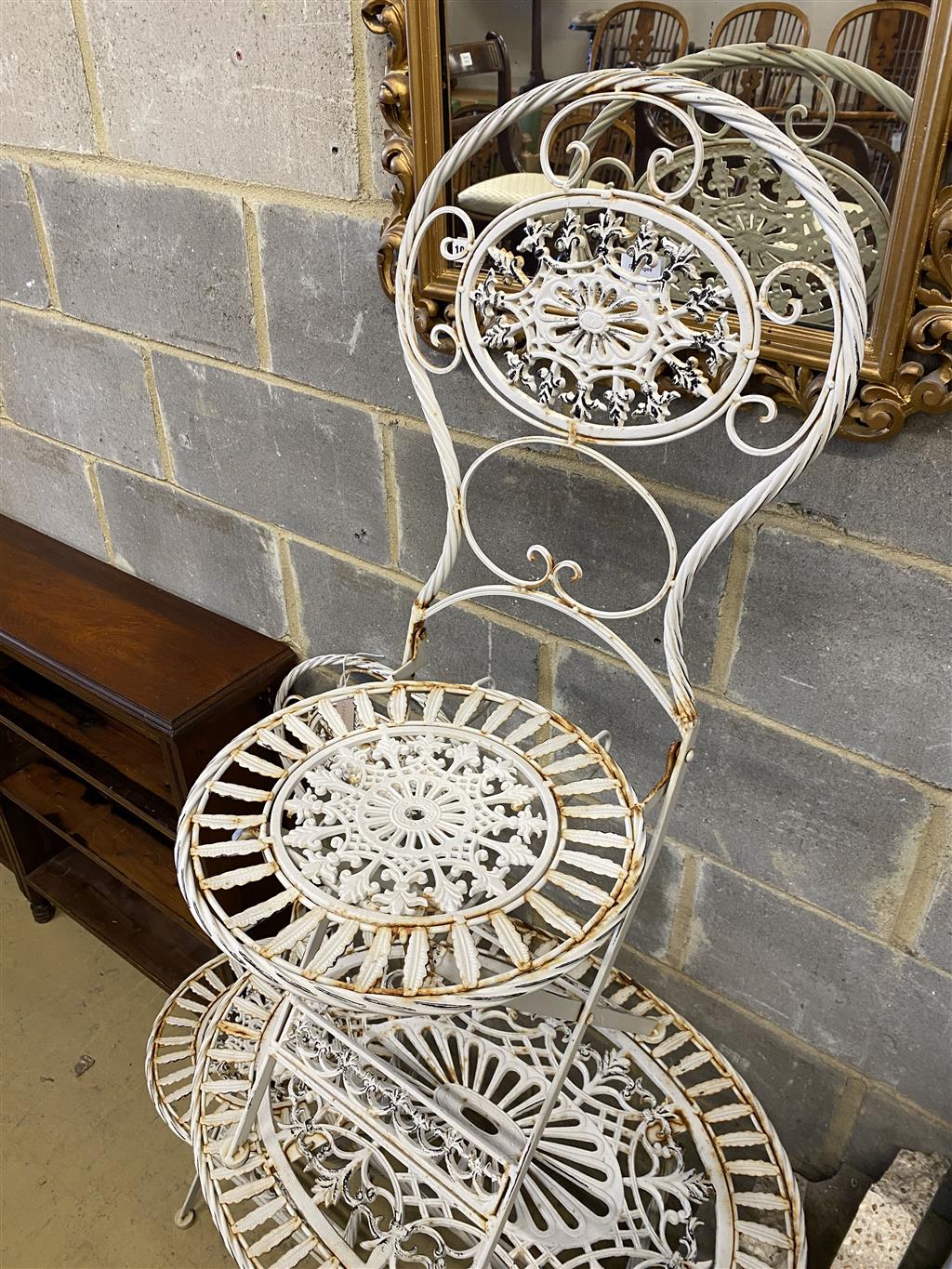 A folding painted aluminium garden table, width 70cm, depth 52cm, height 74cm and two matching chairs